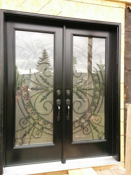 Double exterior doors front entry insulated steel. Black. Traditional Chesterfield wrought iron glass inserts